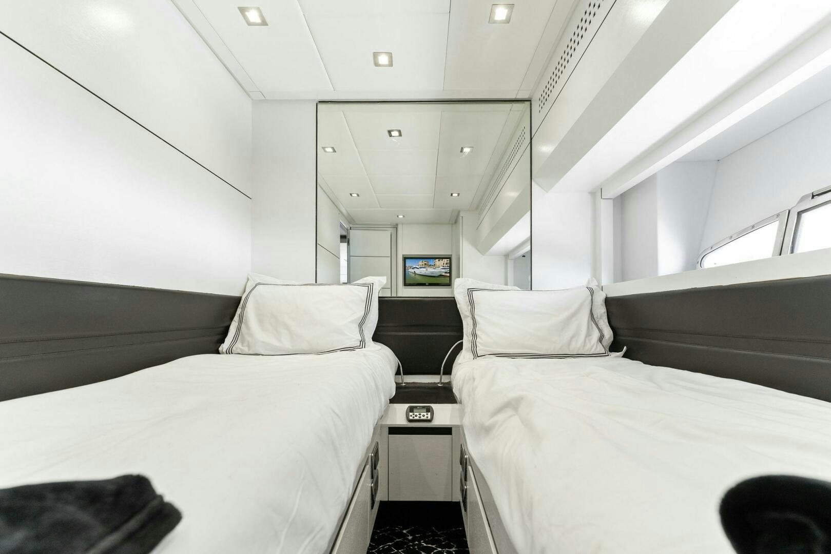 a room with two beds aboard HAWK Yacht for Sale