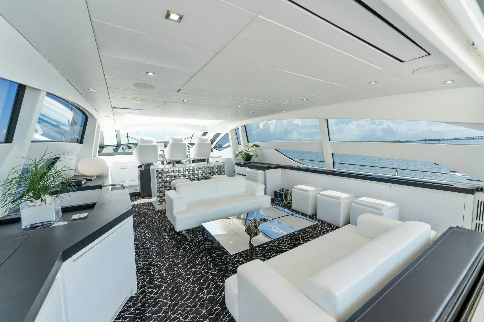 a room with a large window and a view of the ocean aboard HAWK Yacht for Sale