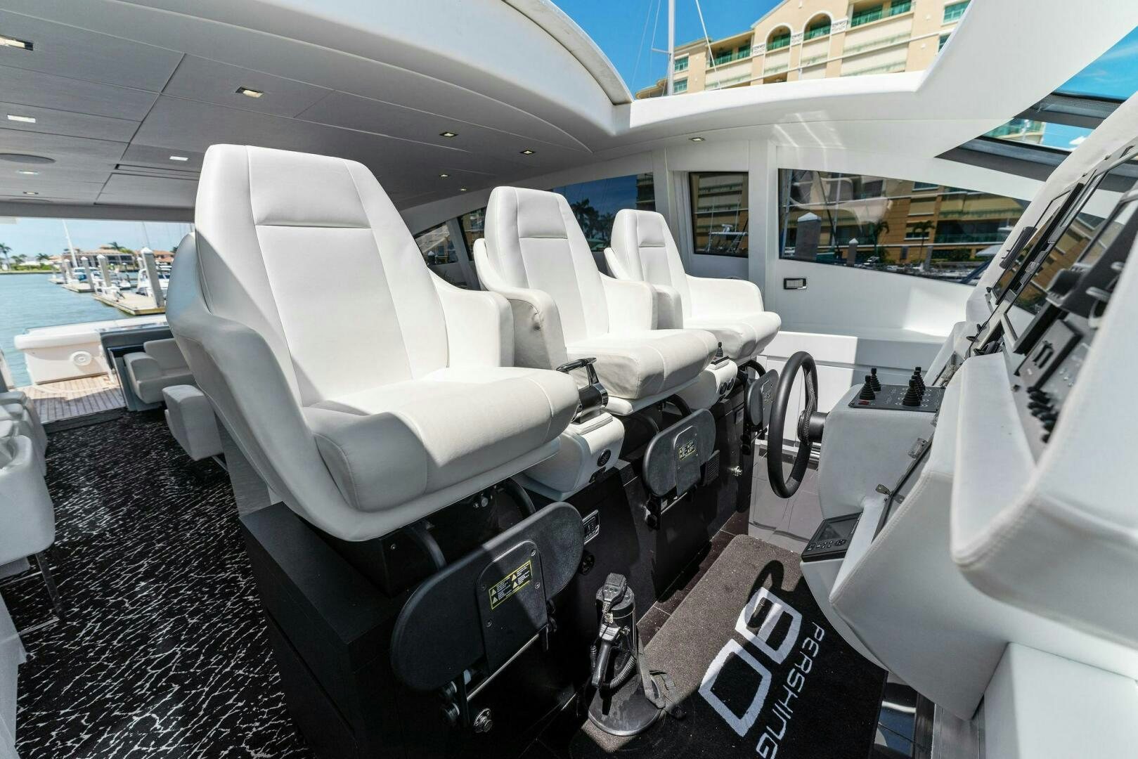 a white car with seats aboard HAWK Yacht for Sale