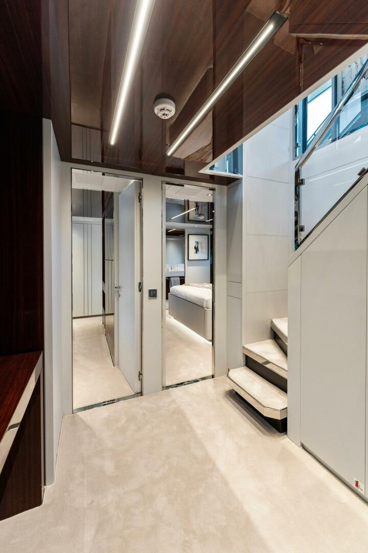 a hallway with white walls aboard CHOP CHOP Yacht for Sale