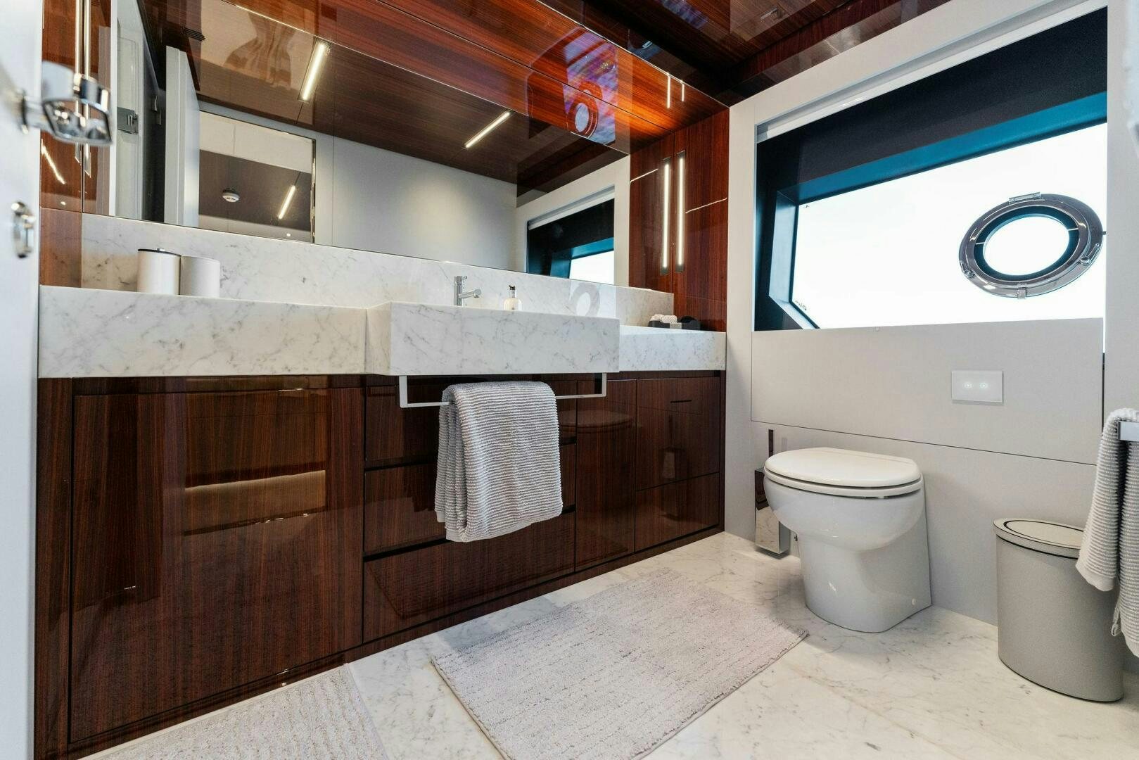 a bathroom with a toilet and a sink aboard CHOP CHOP Yacht for Sale