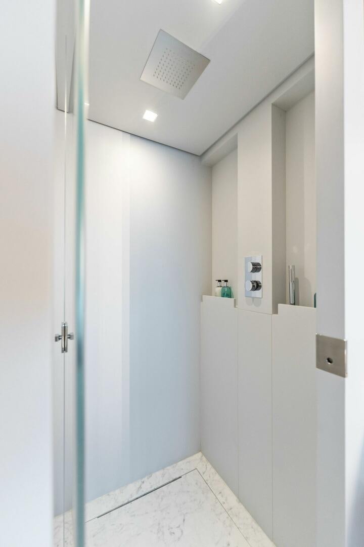 a hallway with white cabinets aboard CHOP CHOP Yacht for Sale