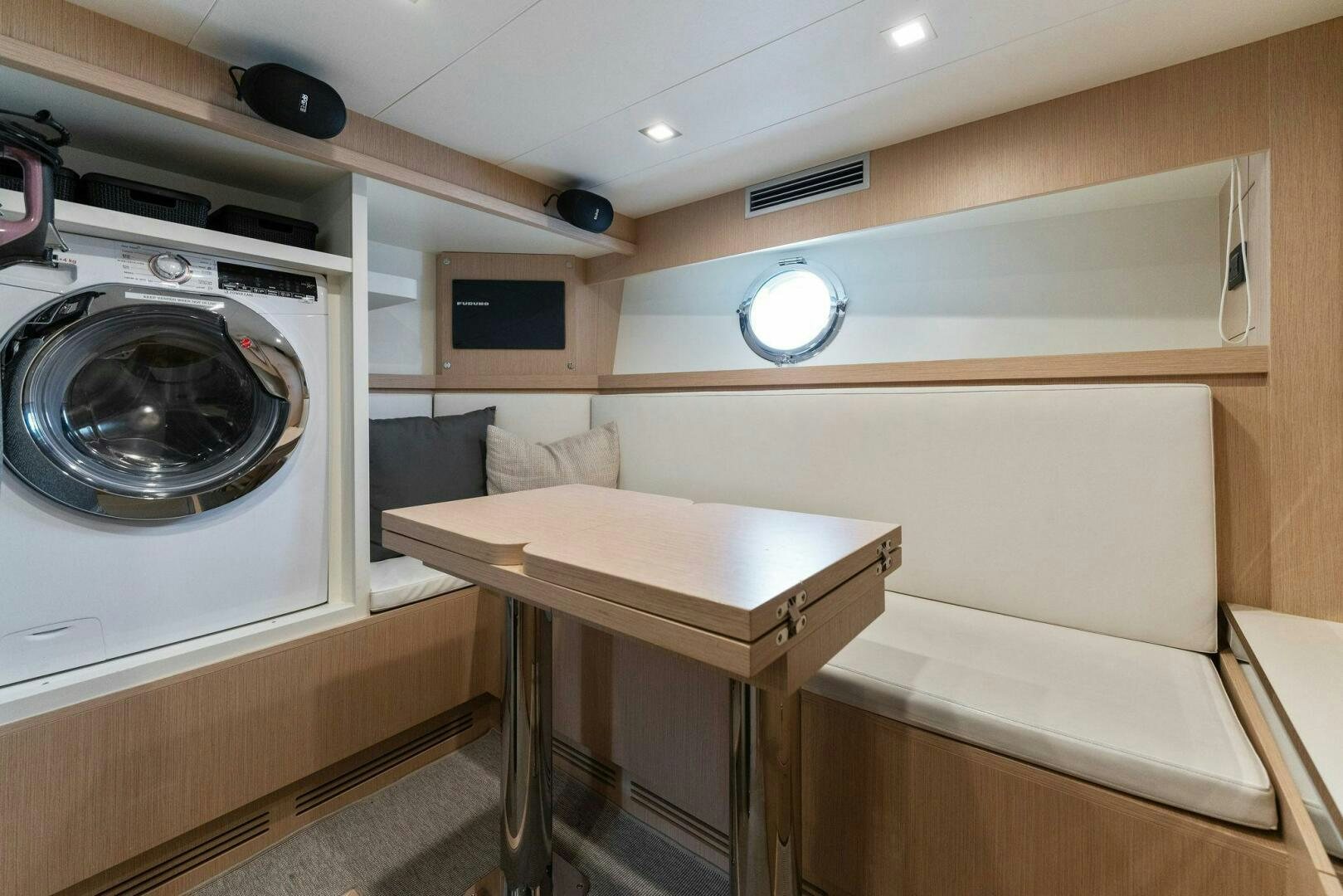 a small kitchen with a table aboard CHOP CHOP Yacht for Sale
