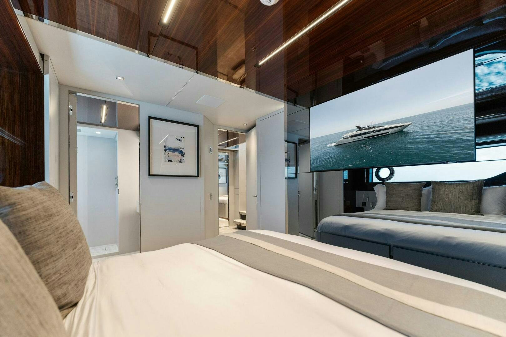 a room with a bed and a television aboard CHOP CHOP Yacht for Sale