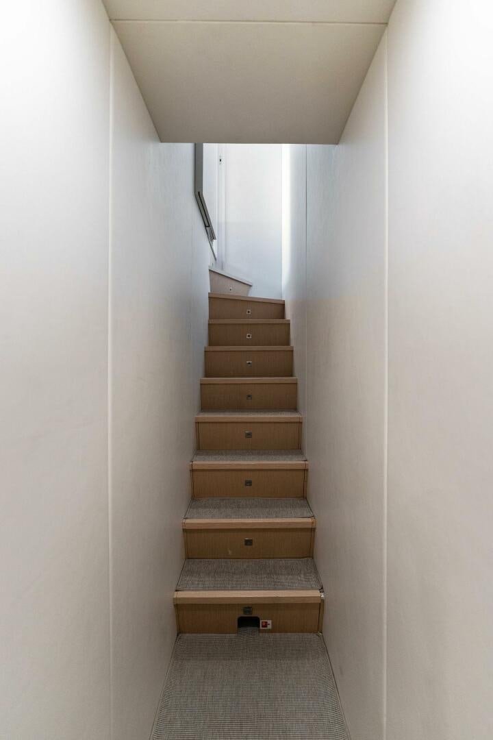 a wooden stair case aboard CHOP CHOP Yacht for Sale