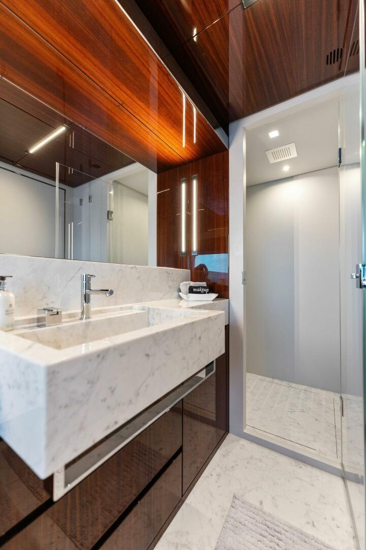 a bathroom with a large mirror aboard CHOP CHOP Yacht for Sale