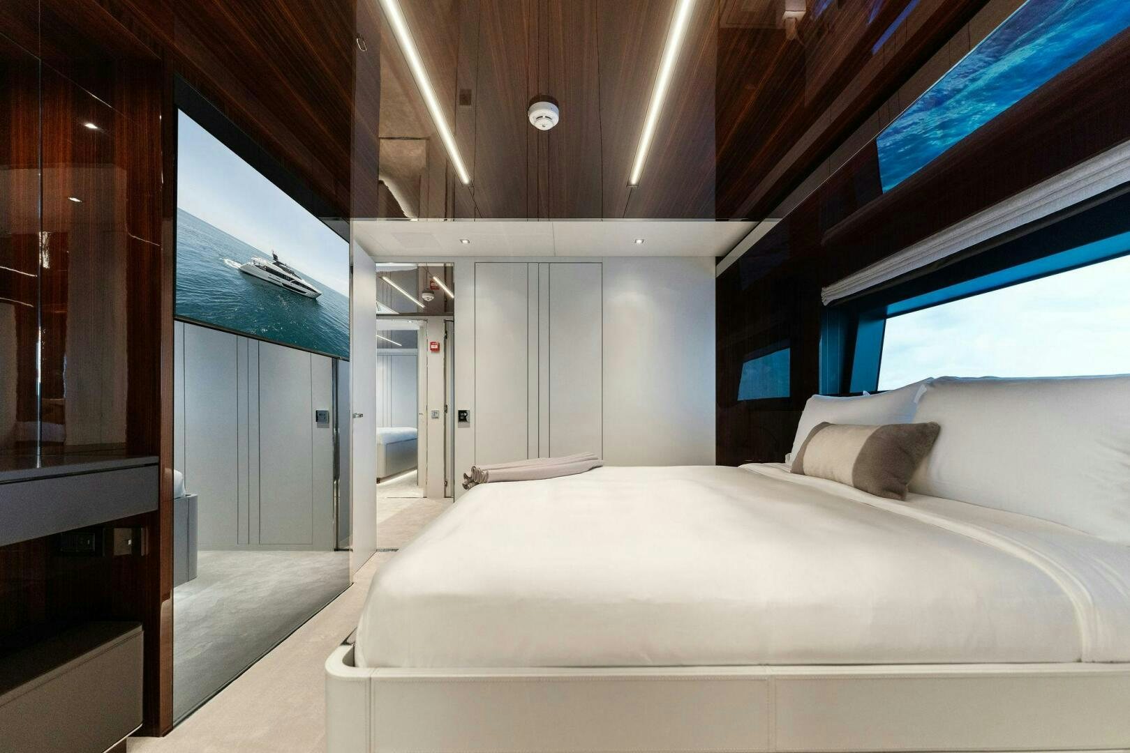 a room with a bed and a window aboard CHOP CHOP Yacht for Sale