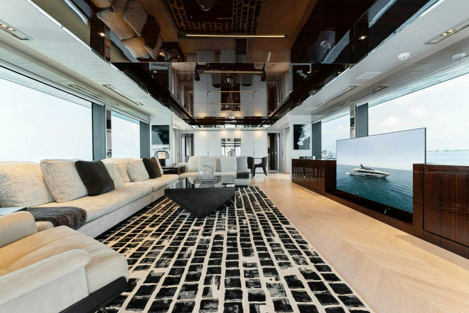 a room with a couch and a television aboard CHOP CHOP Yacht for Sale