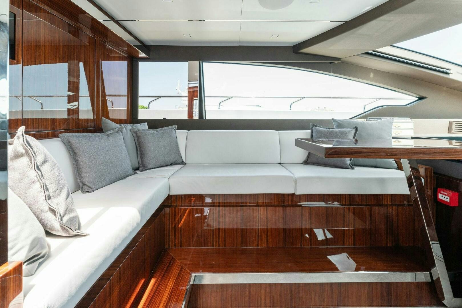 a room with couches and a table aboard CHOP CHOP Yacht for Sale