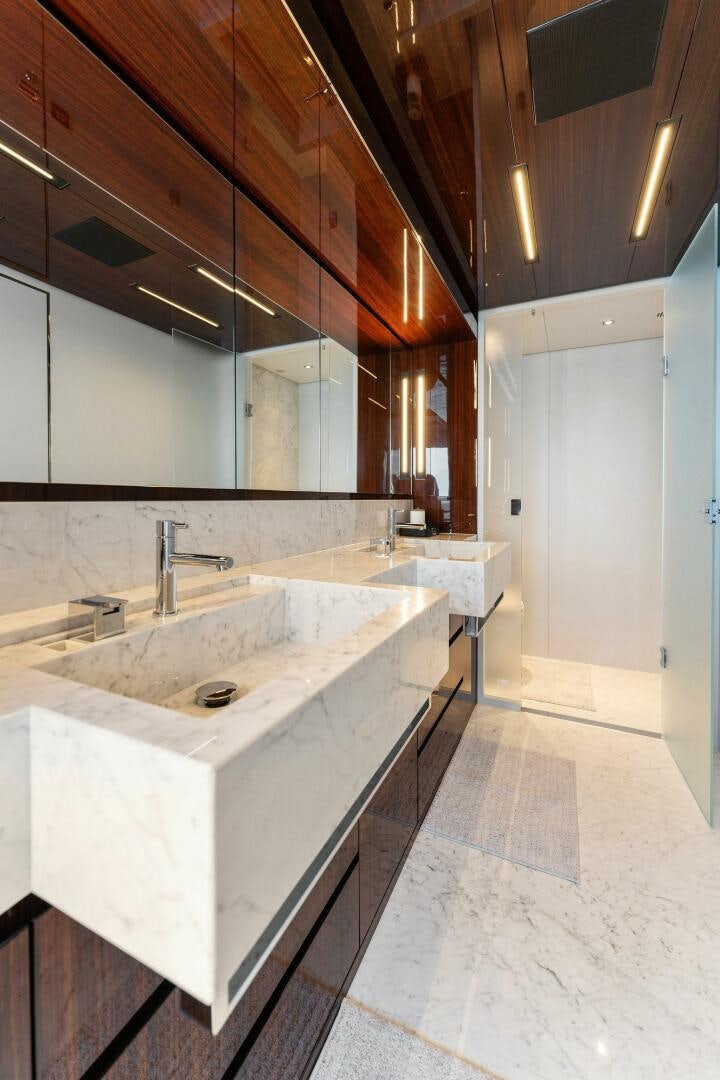 a bathroom with sinks and mirrors aboard CHOP CHOP Yacht for Sale