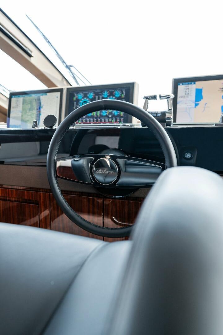 the steering wheel and dashboard of a car aboard CHOP CHOP Yacht for Sale