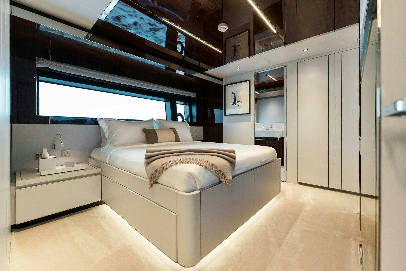 a bedroom with a bed and a desk aboard CHOP CHOP Yacht for Sale
