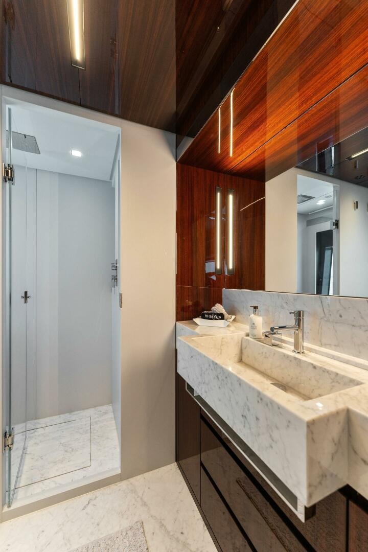 a bathroom with a sink and a mirror aboard CHOP CHOP Yacht for Sale