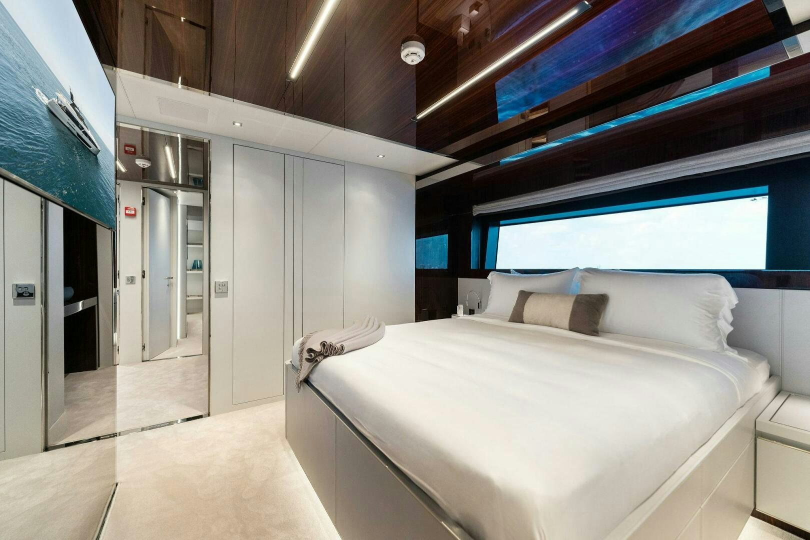 a room with a bed and a window aboard CHOP CHOP Yacht for Sale