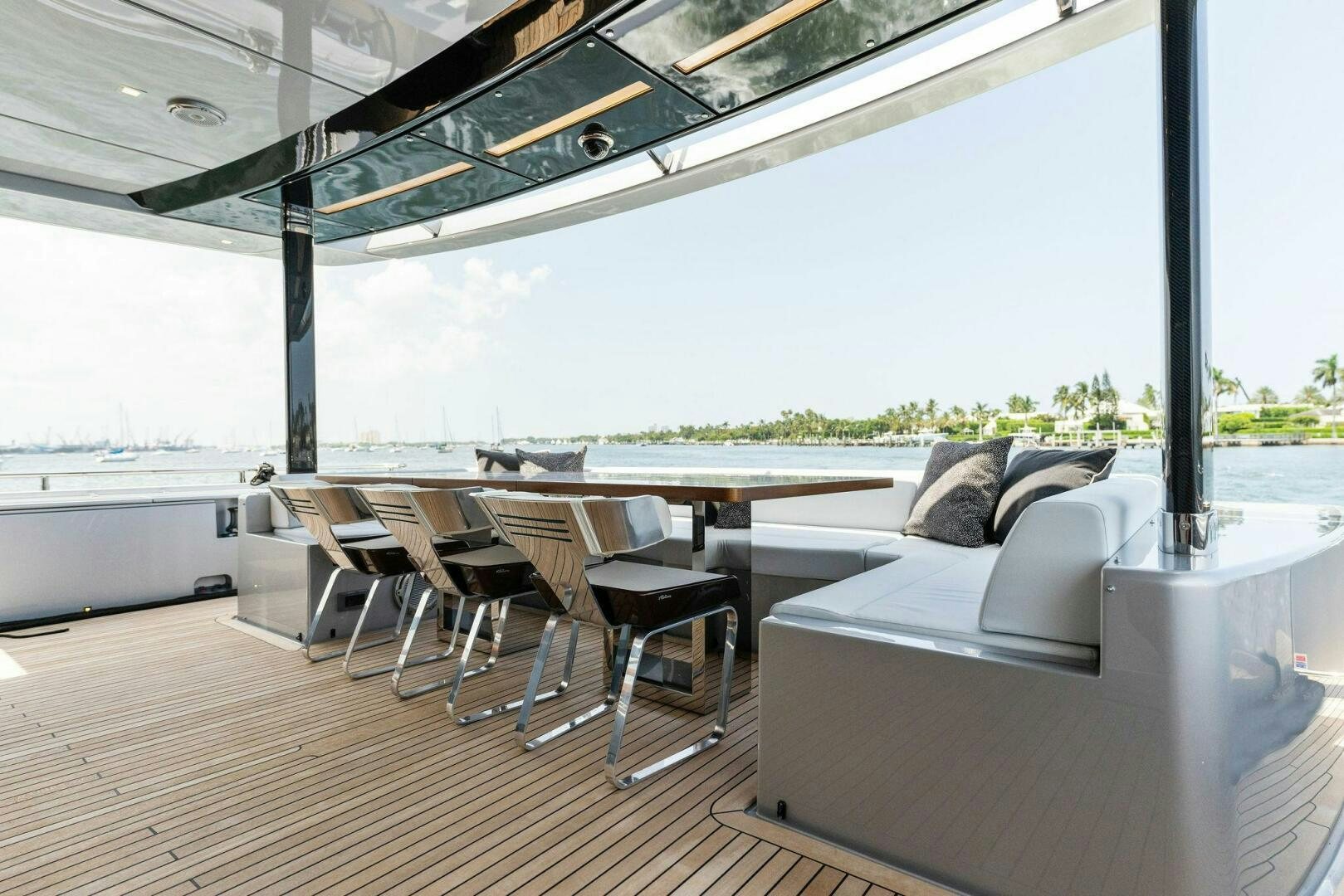 a room with a couch and a table and chairs aboard CHOP CHOP Yacht for Sale