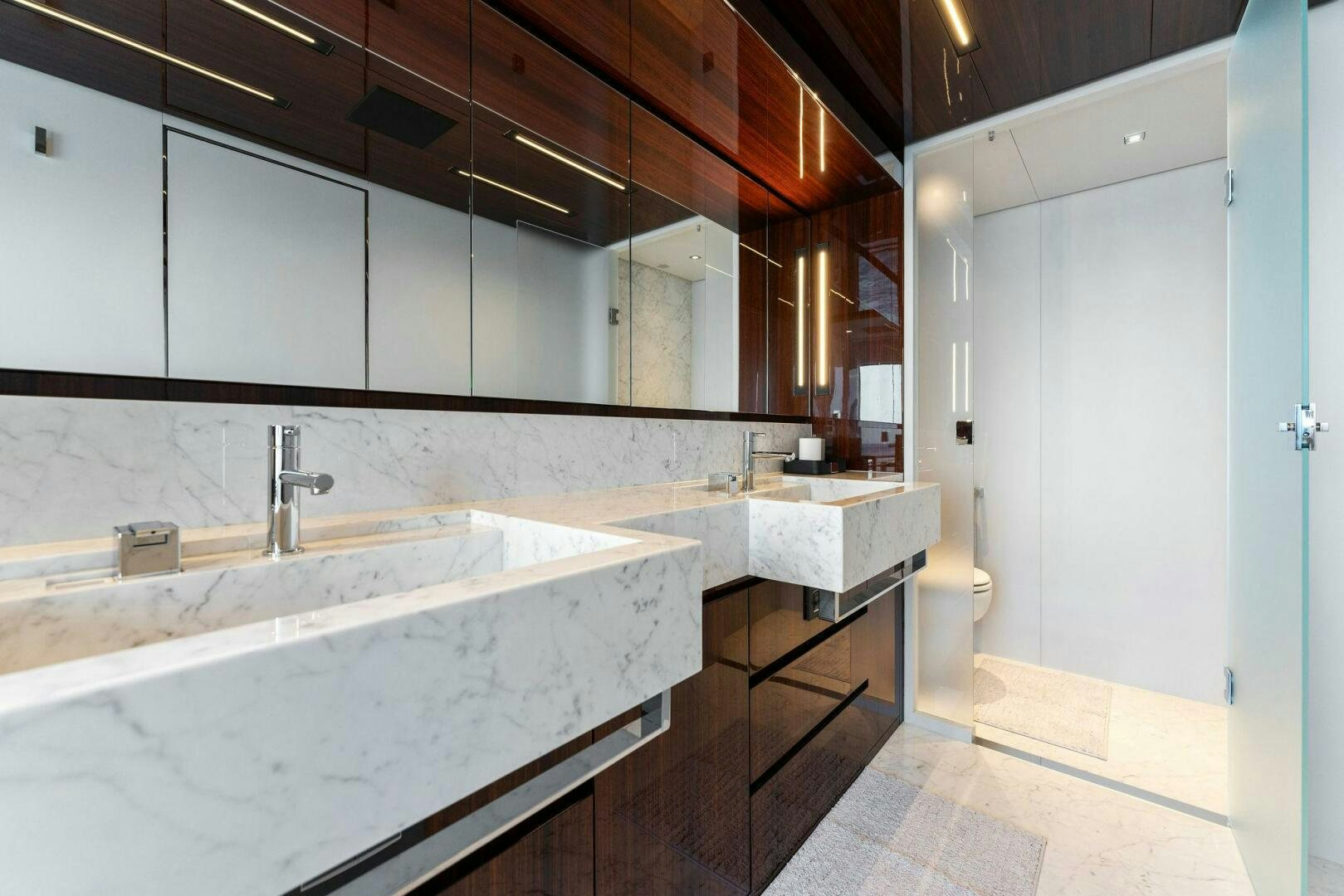 a bathroom with a large mirror aboard CHOP CHOP Yacht for Sale