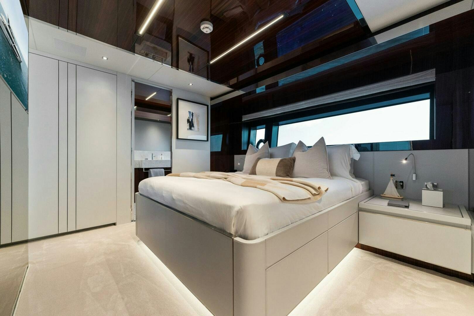 a room with a bed and a desk aboard CHOP CHOP Yacht for Sale