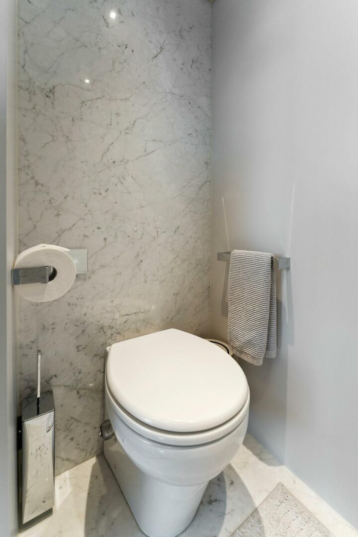 a toilet in a bathroom aboard CHOP CHOP Yacht for Sale