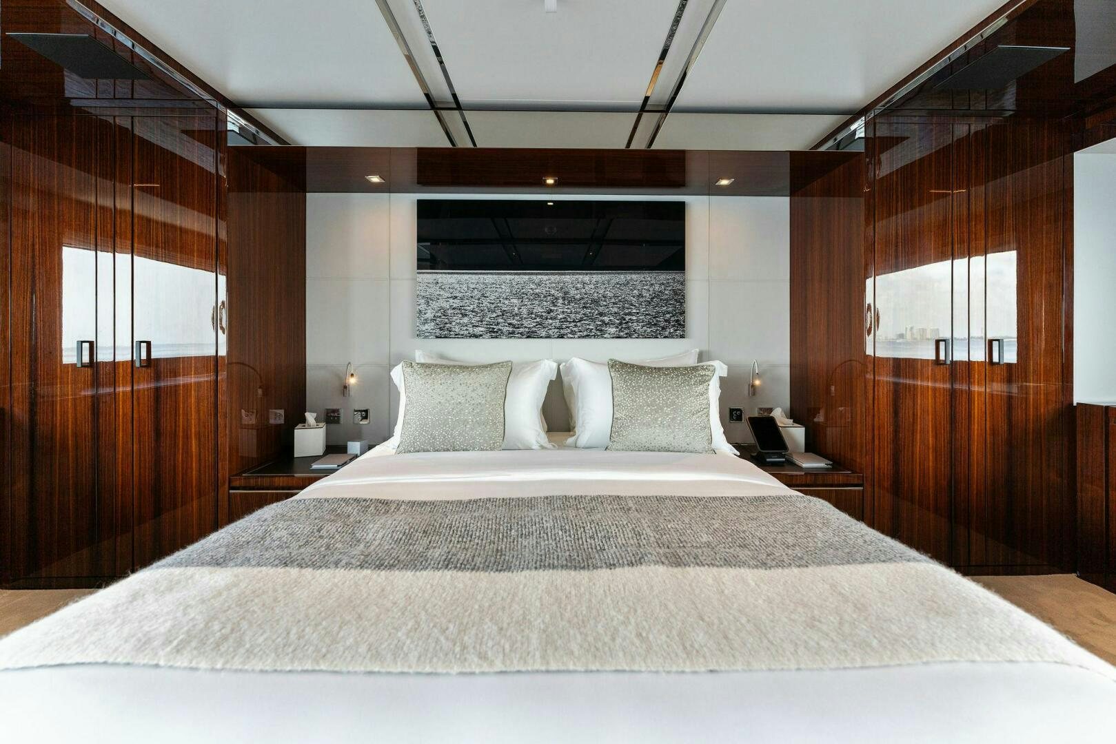 a large bed with white sheets aboard CHOP CHOP Yacht for Sale