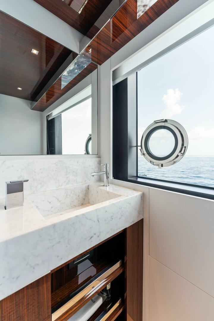 a bathroom with a large mirror aboard CHOP CHOP Yacht for Sale