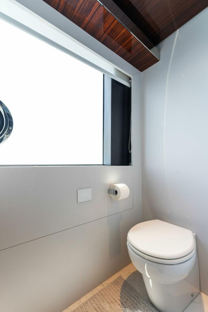 a toilet in a bathroom aboard CHOP CHOP Yacht for Sale
