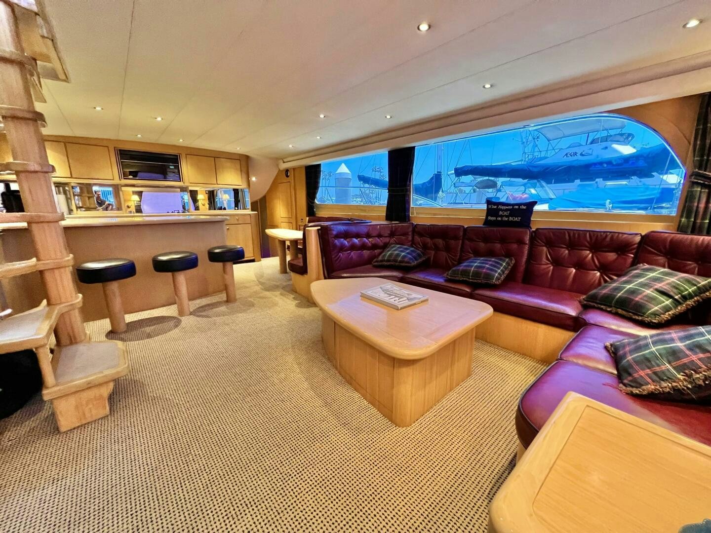 a living room with a large screen aboard GOOD KARMA Yacht for Sale