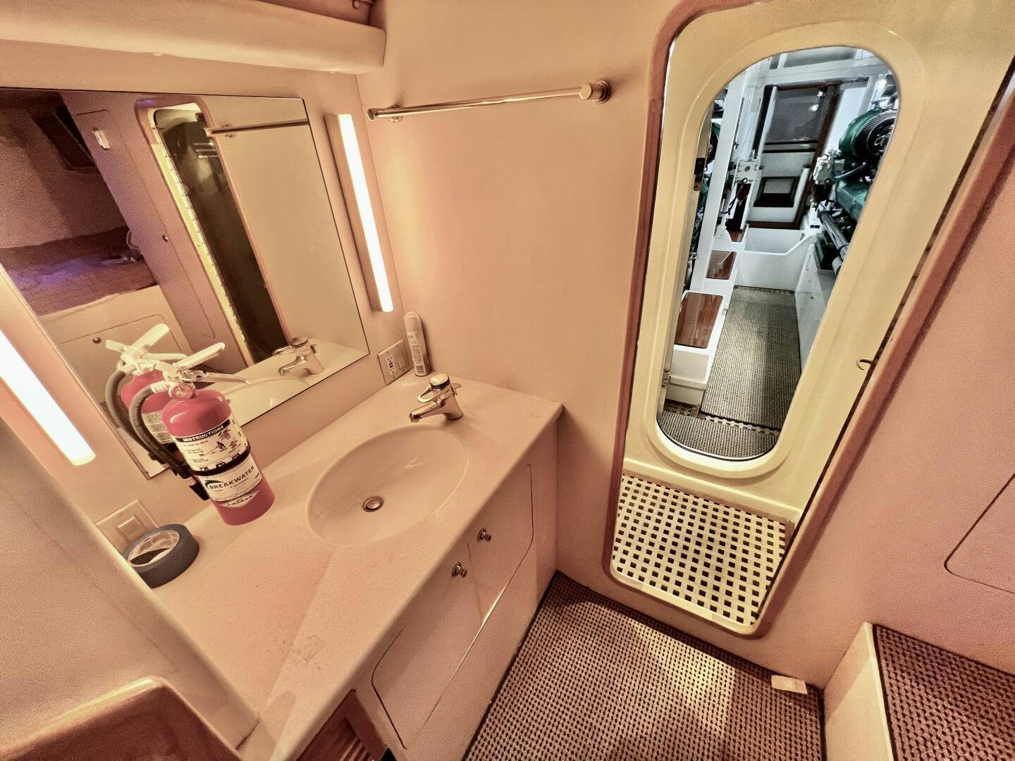 a bathroom with a large mirror aboard GOOD KARMA Yacht for Sale