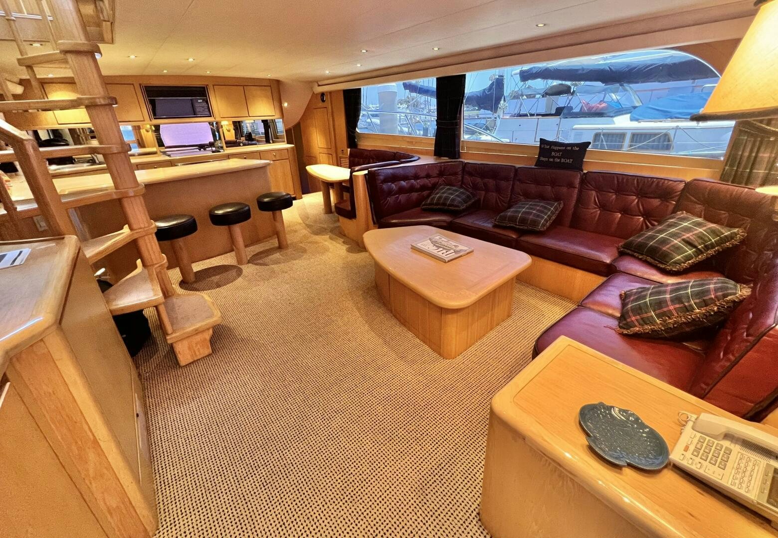 a living room with a couch and a table aboard GOOD KARMA Yacht for Sale