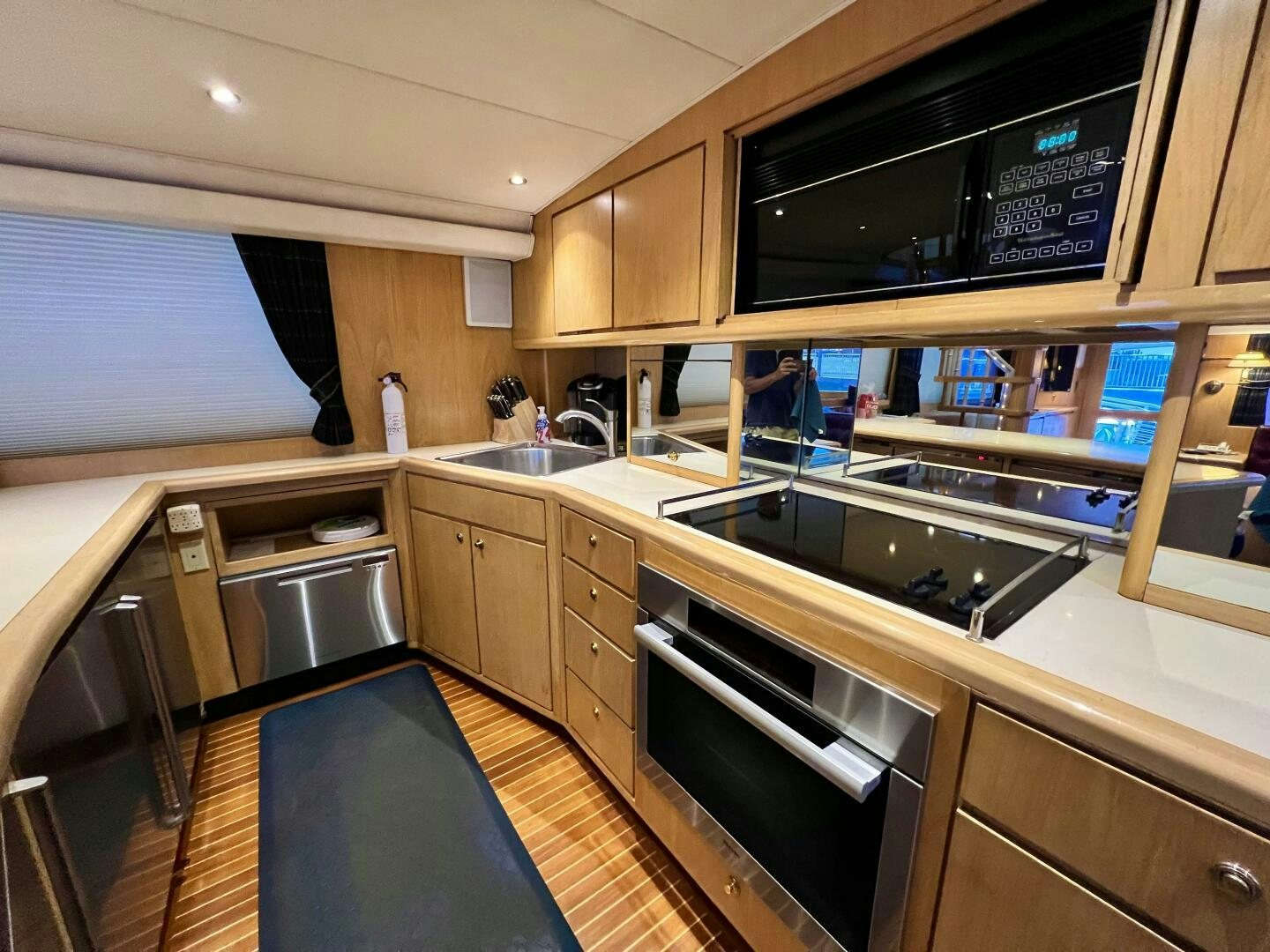 a kitchen with a countertop sink and cabinets aboard GOOD KARMA Yacht for Sale