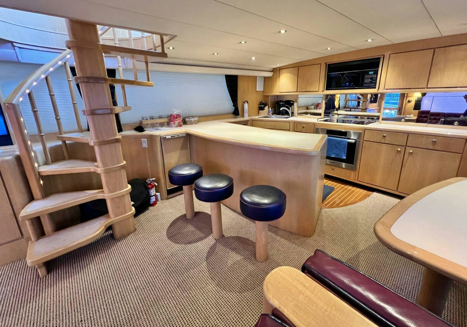 a kitchen with a ladder aboard GOOD KARMA Yacht for Sale