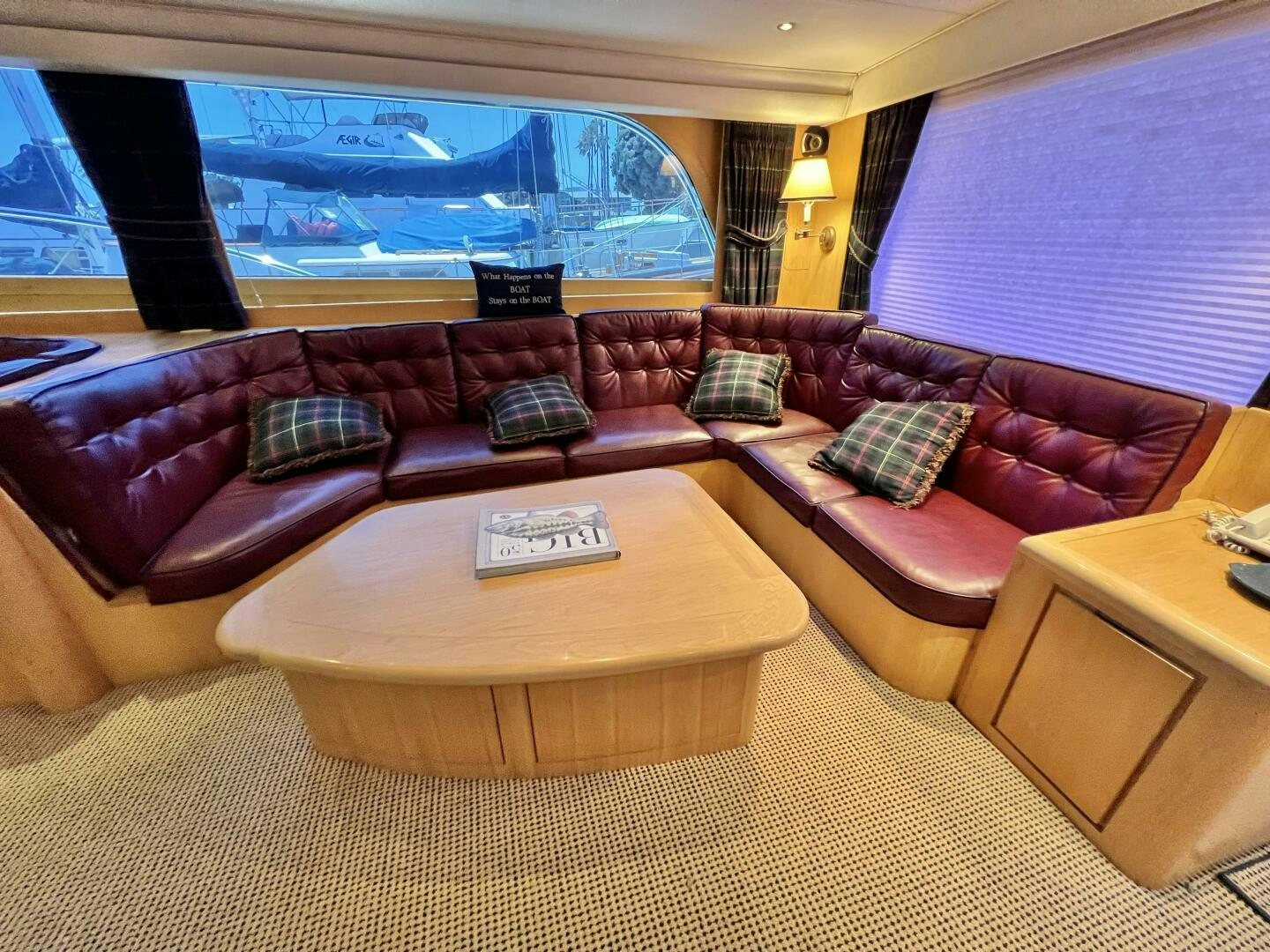 a living room with a large window aboard GOOD KARMA Yacht for Sale