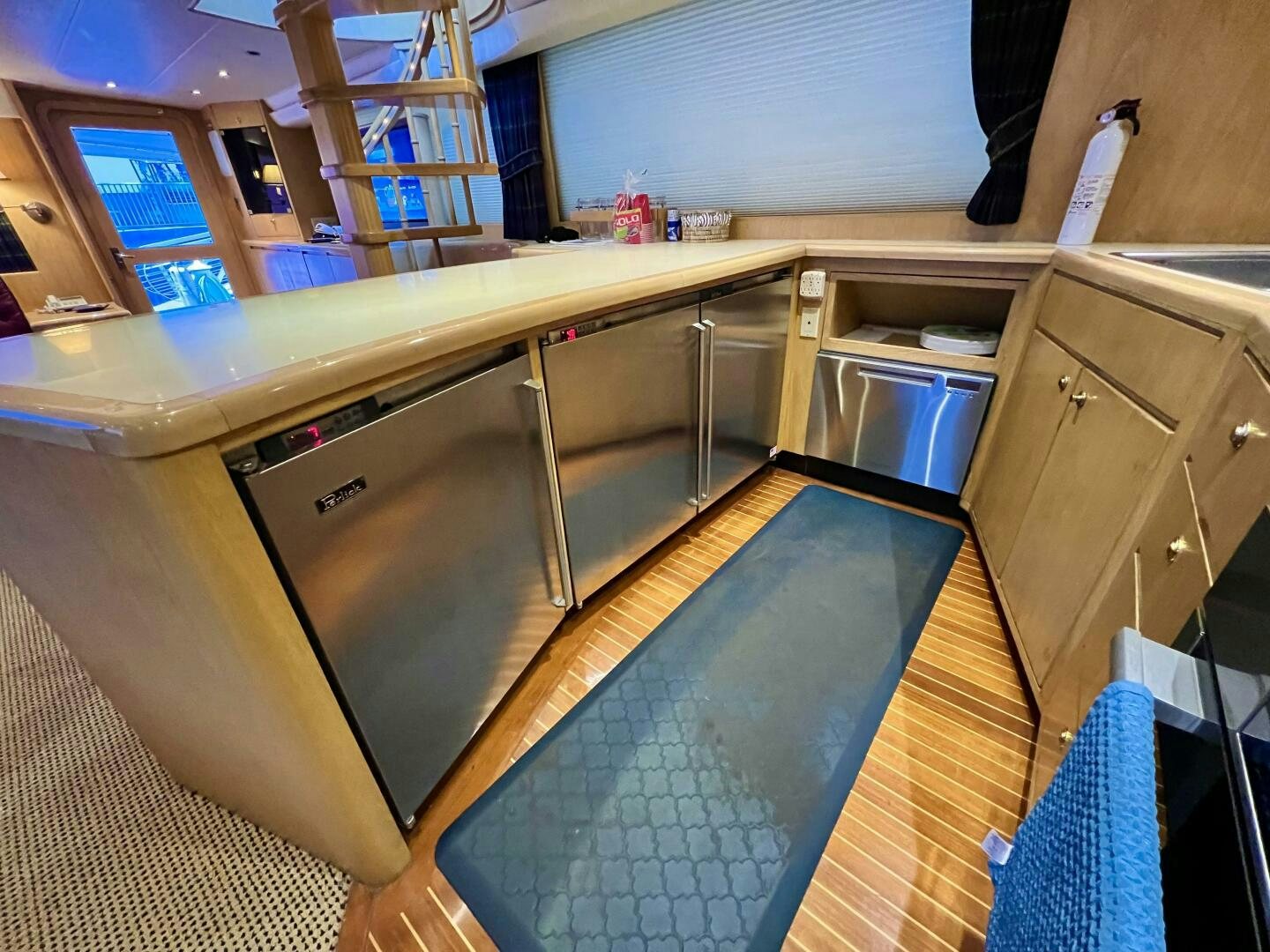 a kitchen with a large island aboard GOOD KARMA Yacht for Sale