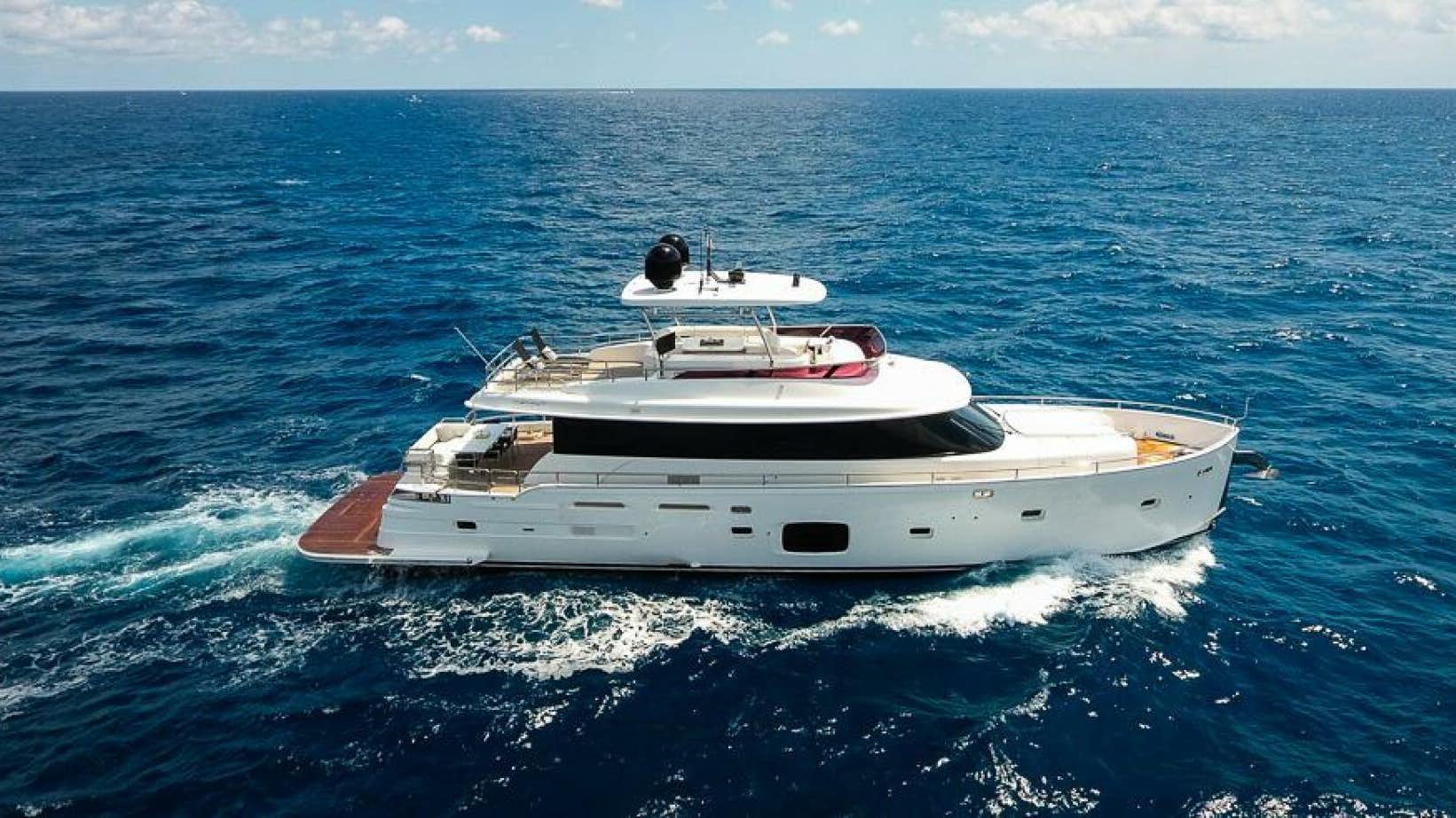 a white boat in the water aboard THE EQUITES Yacht for Sale