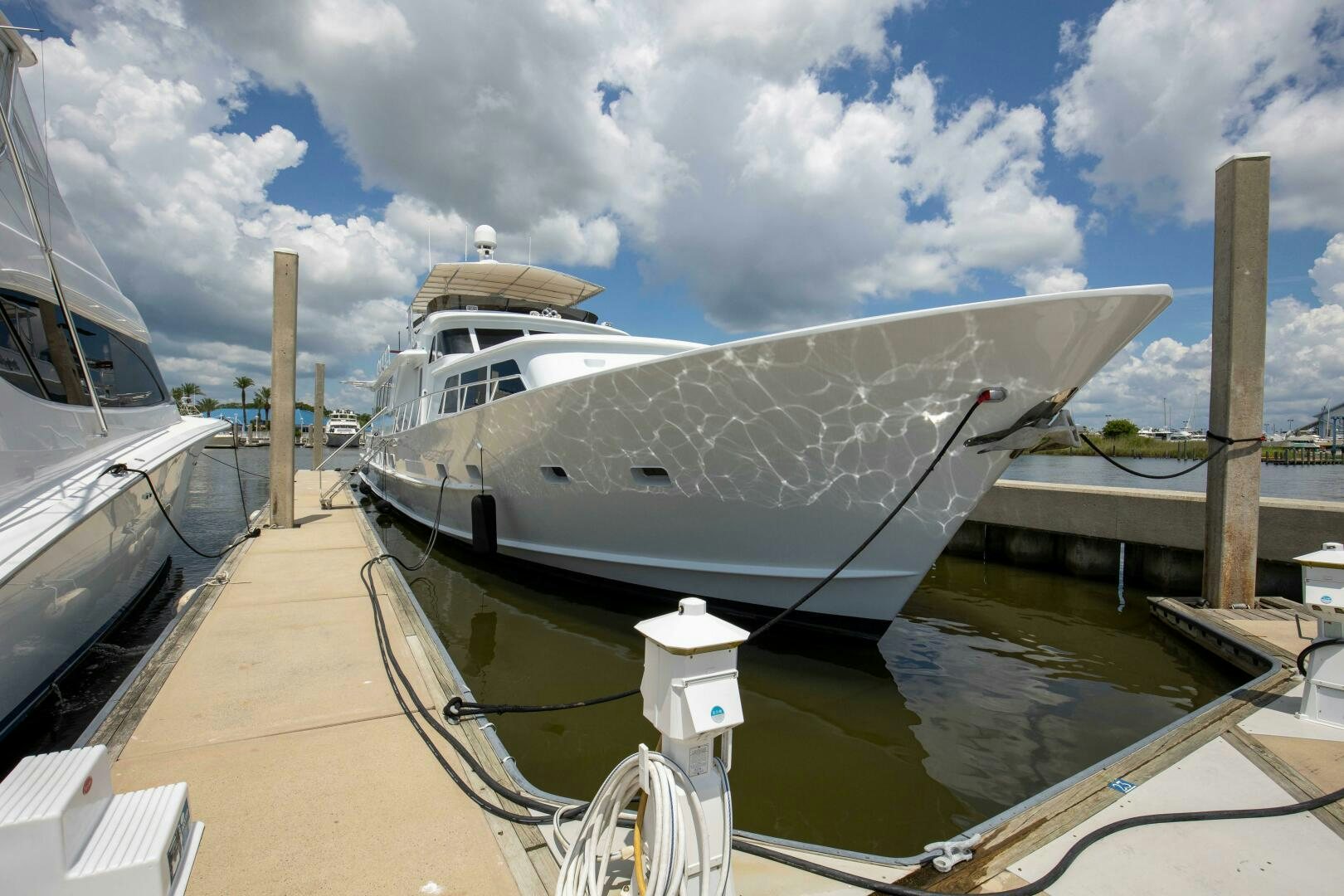 a boat docked at a pier aboard LADY P Yacht for Sale