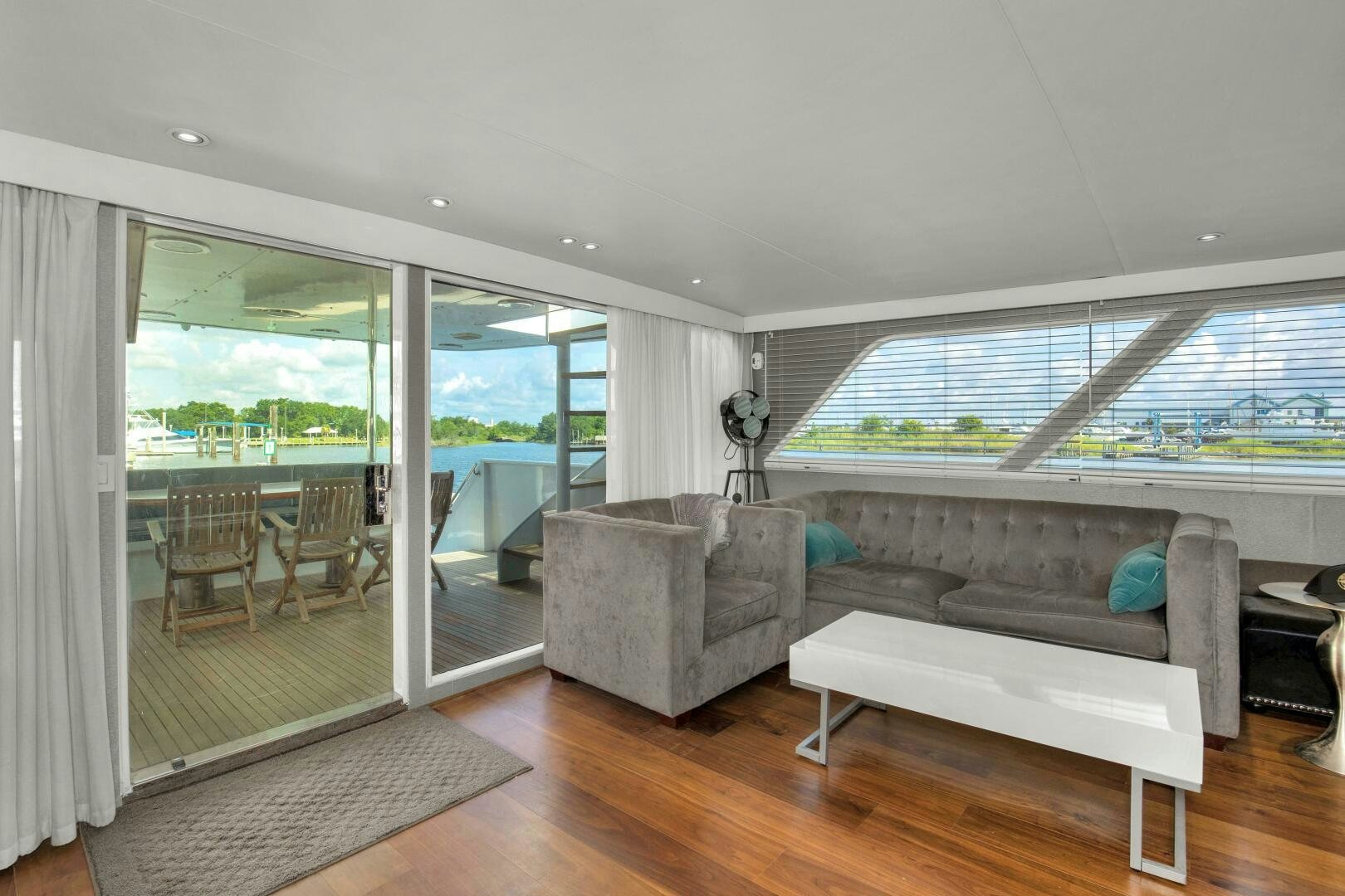 a living room with a large window aboard LADY P Yacht for Sale
