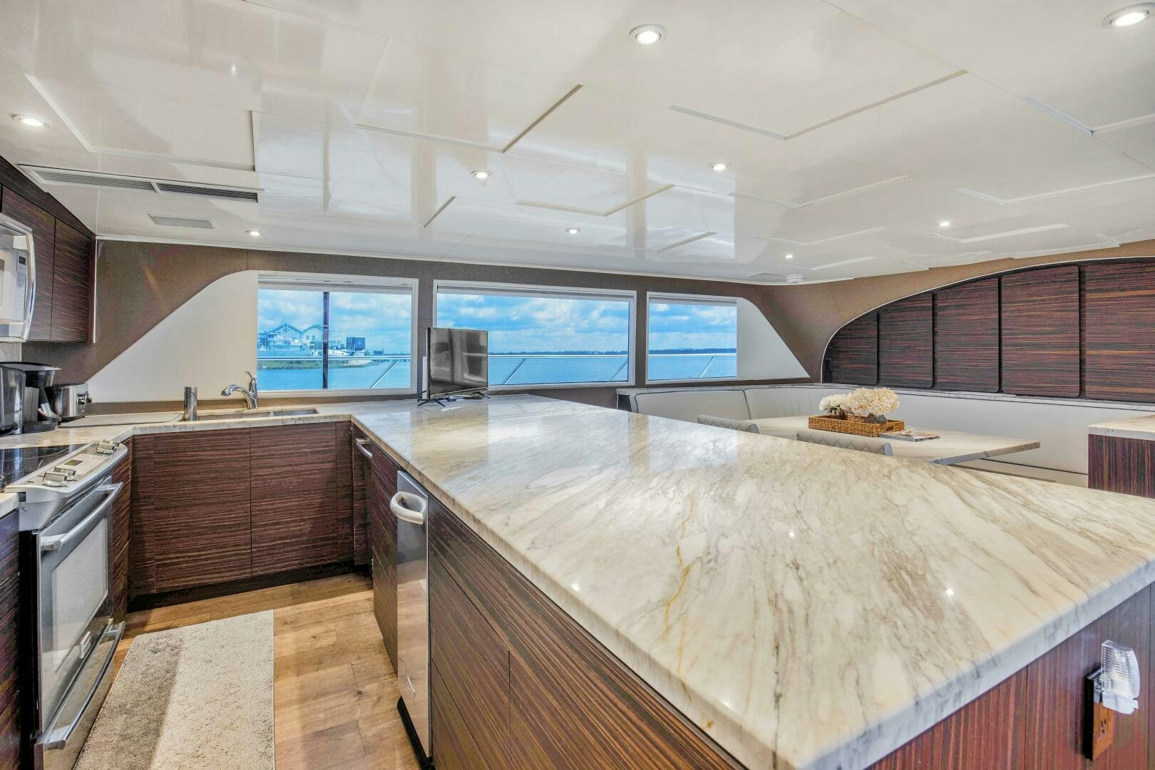 a kitchen with a marble counter top aboard LADY P Yacht for Sale