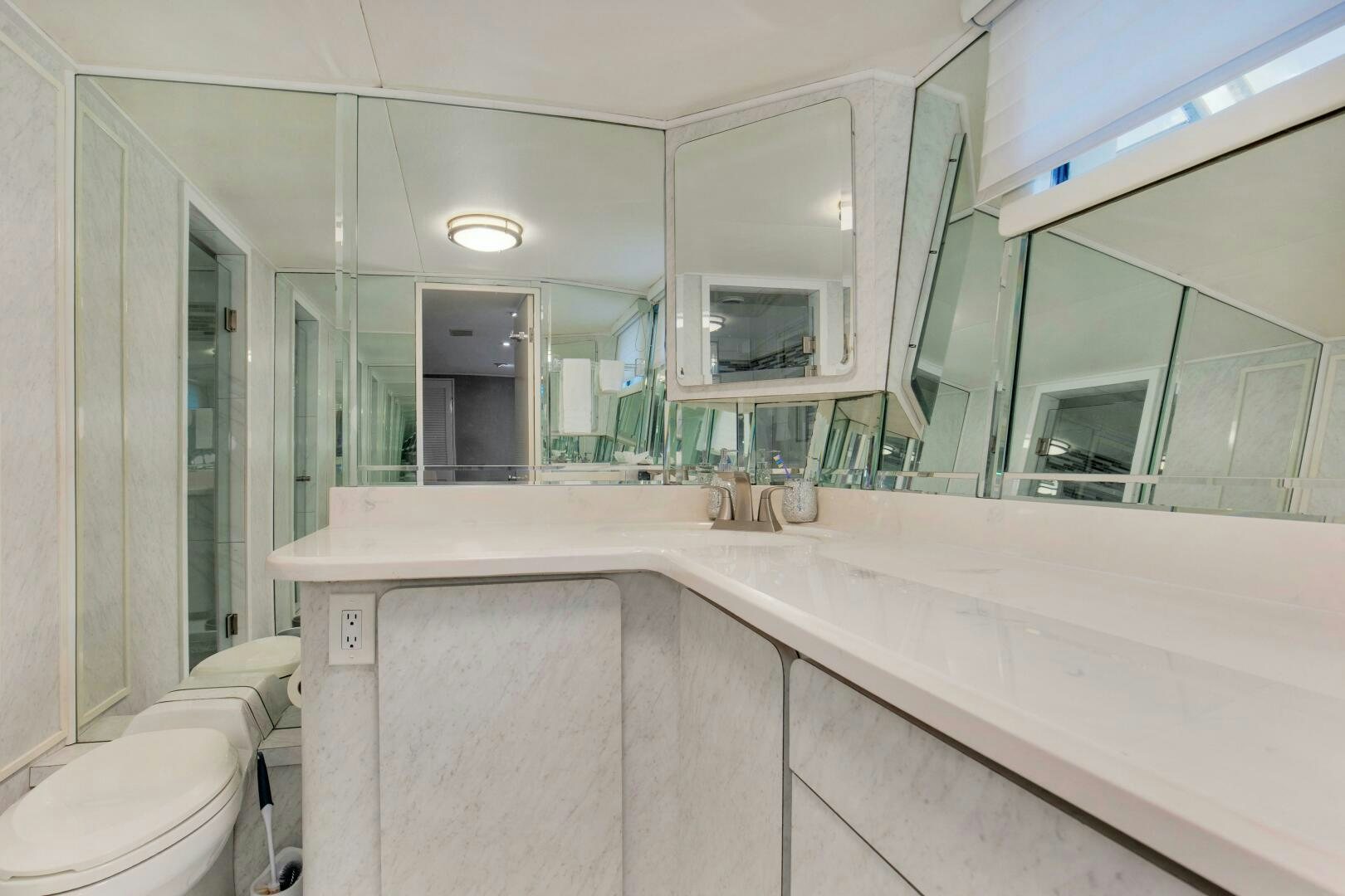a bathroom with a large mirror aboard LADY P Yacht for Sale