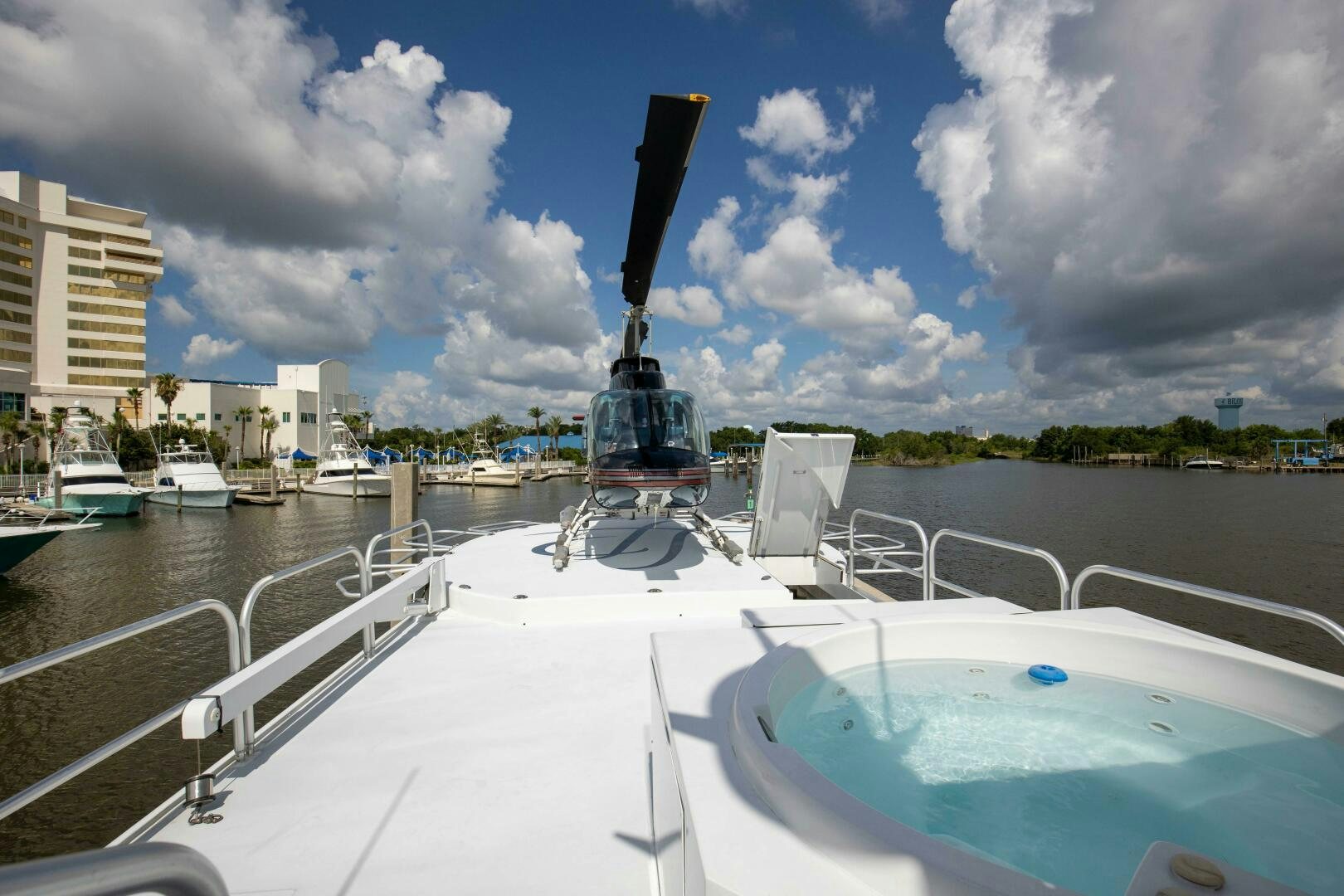 a pool next to a large building aboard LADY P Yacht for Sale