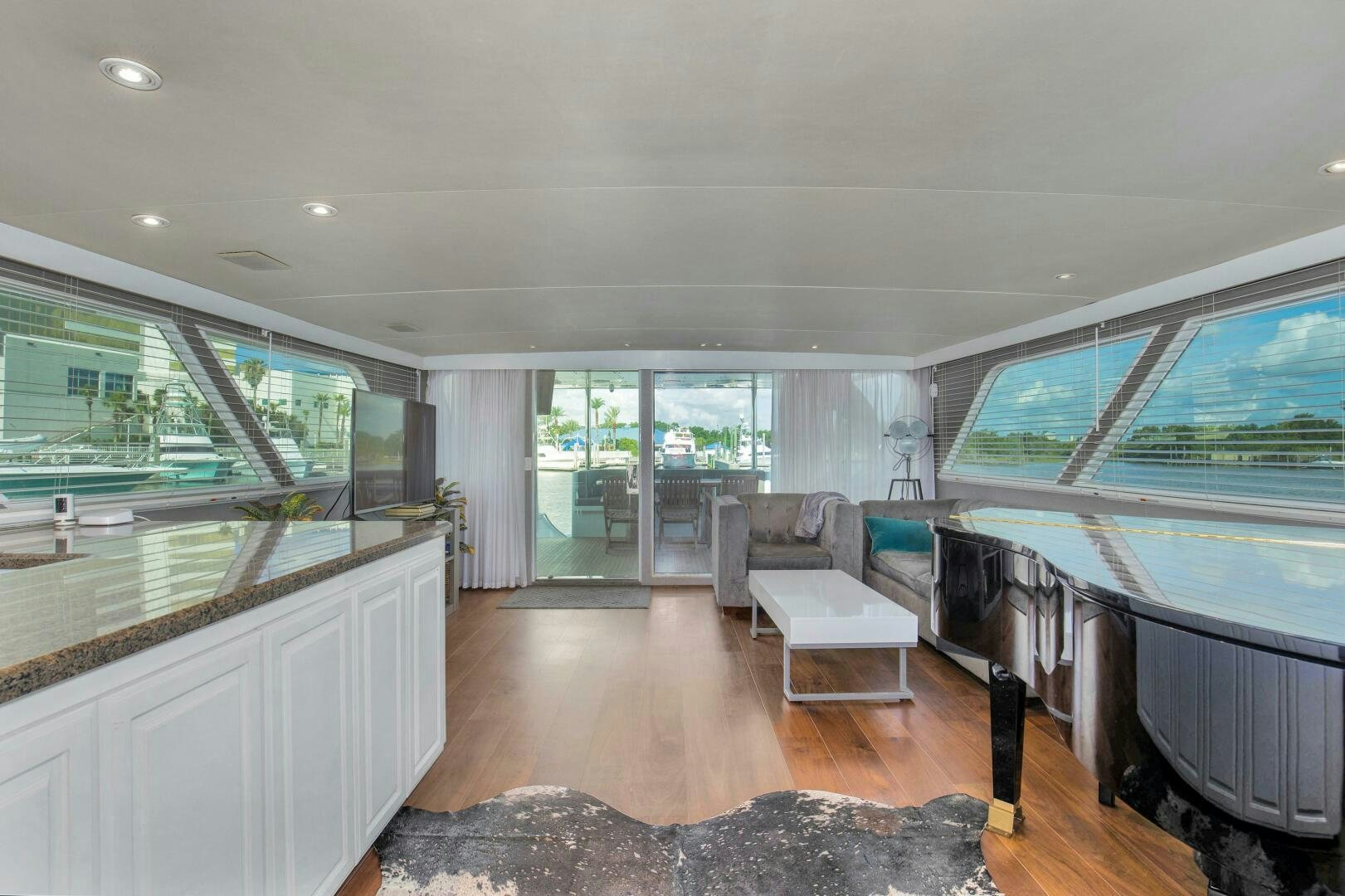 a large living room with a large window aboard LADY P Yacht for Sale