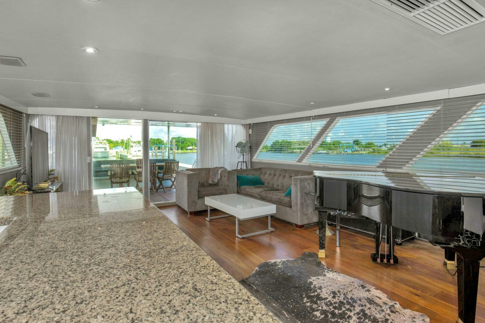 a living room with a large window aboard LADY P Yacht for Sale