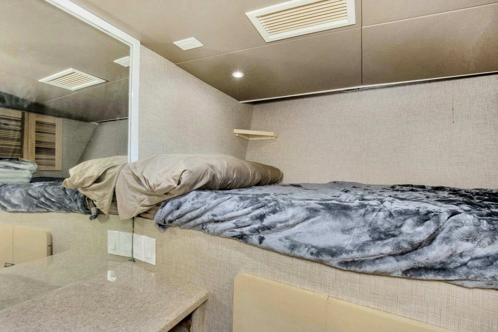 a bed in a room aboard LADY P Yacht for Sale