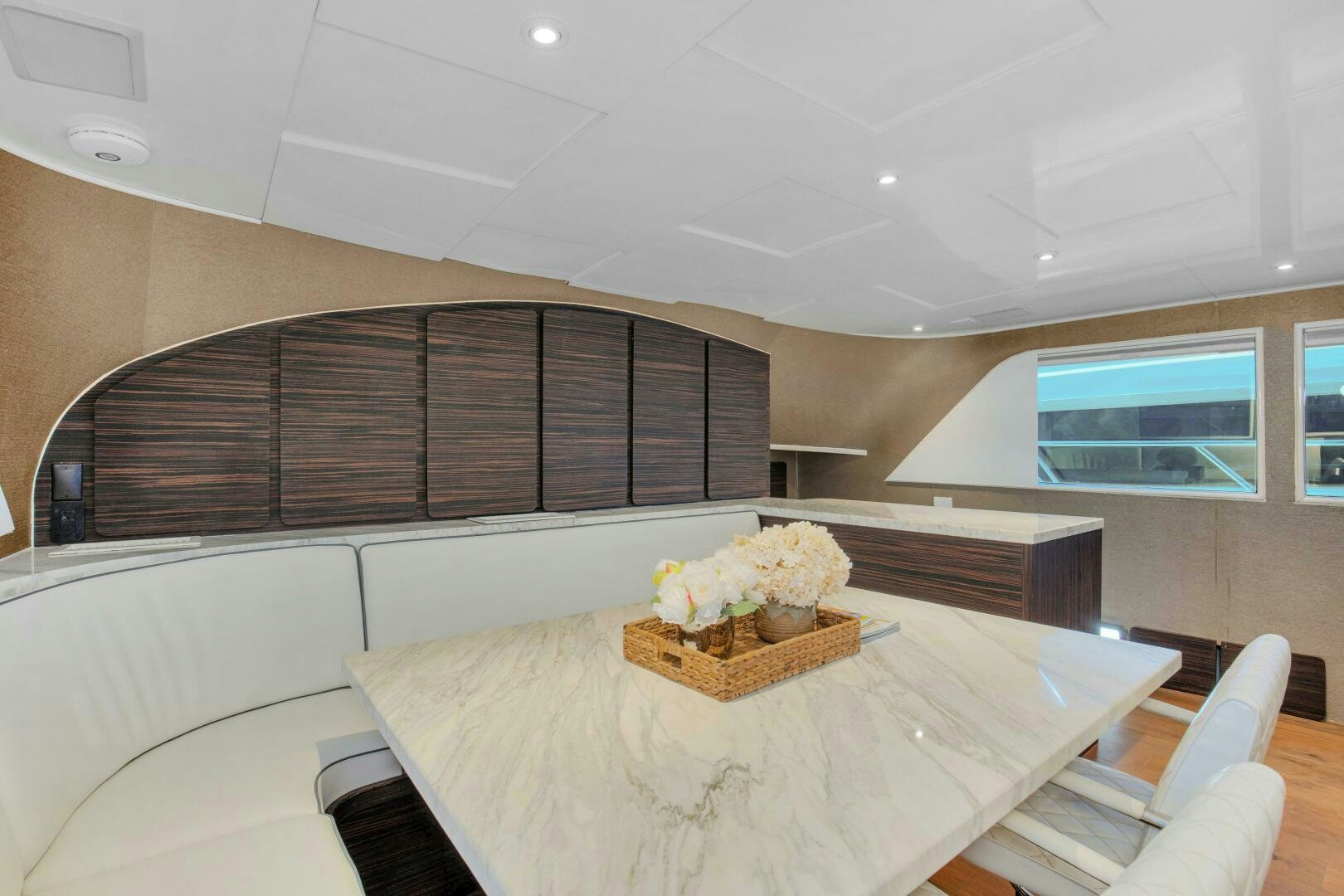 a room with a table and chairs aboard LADY P Yacht for Sale