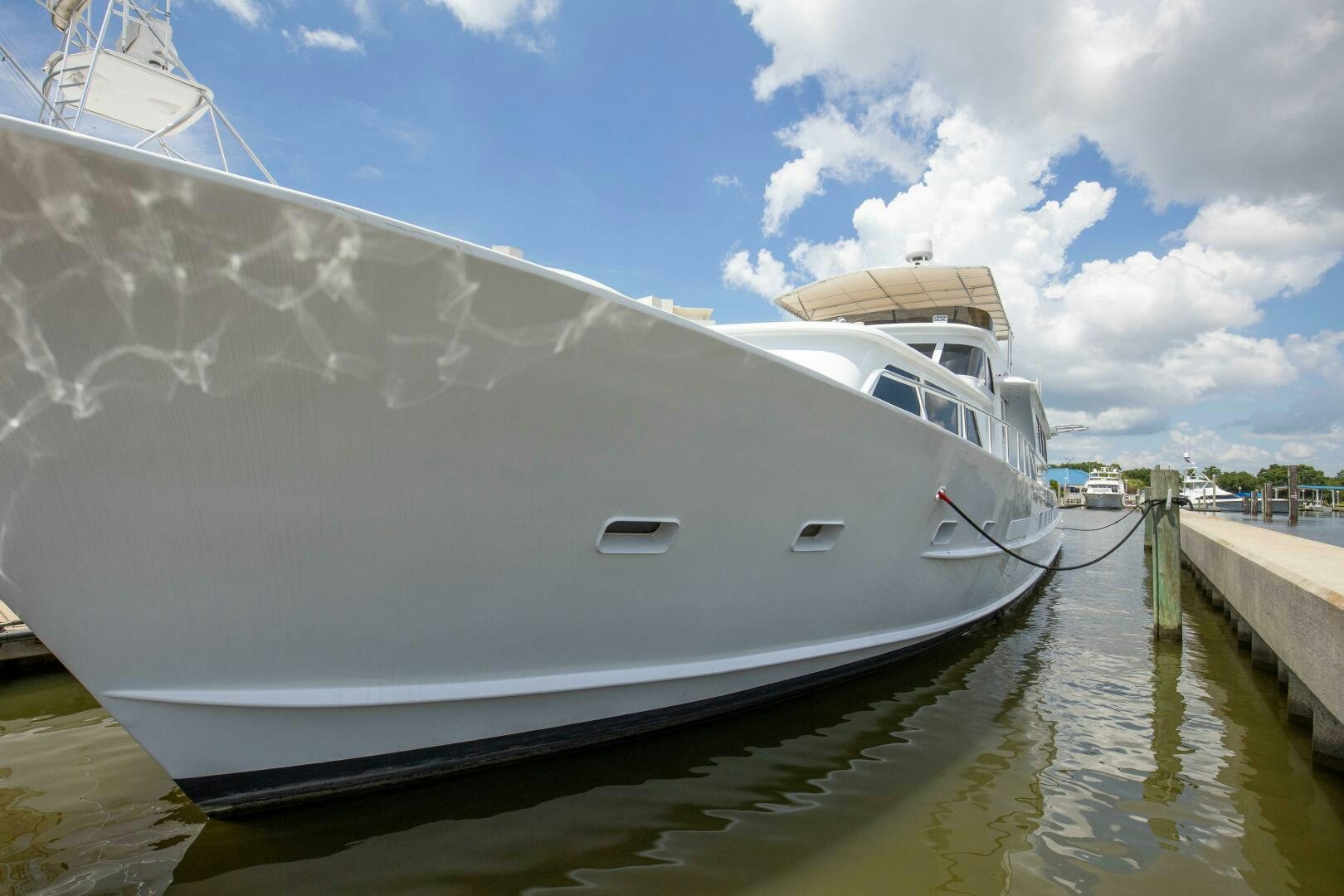 a large white boat docked aboard LADY P Yacht for Sale