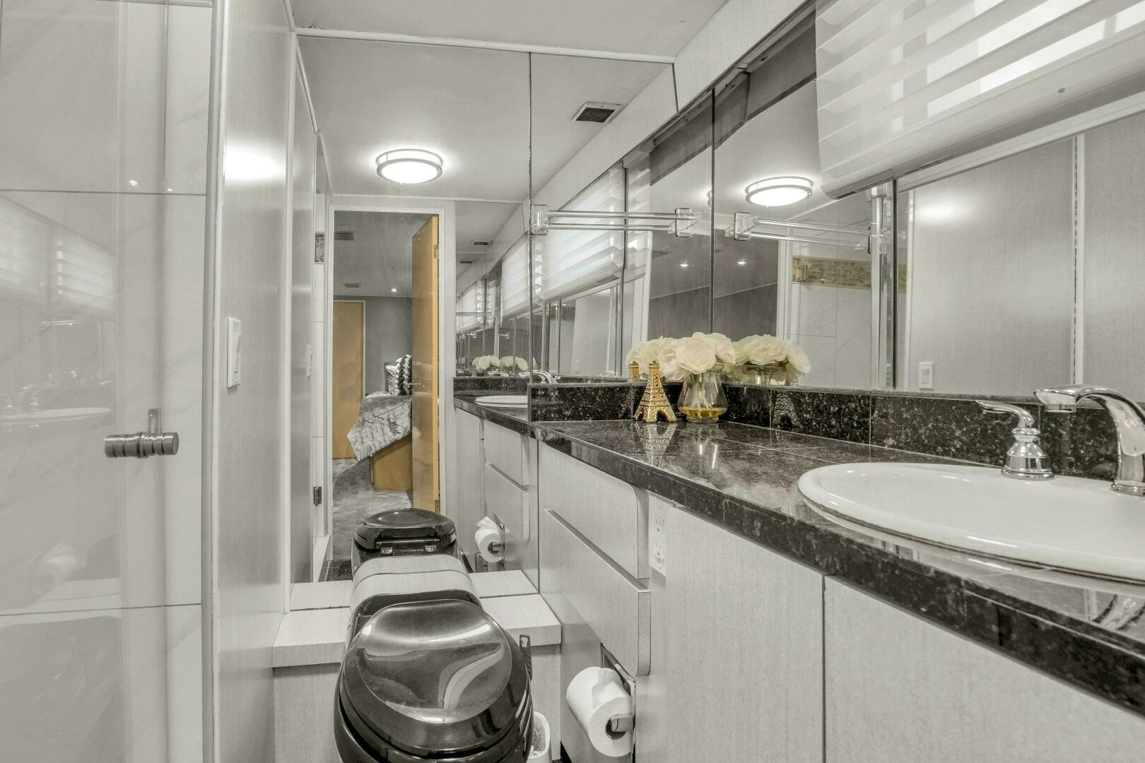 a bathroom with a large mirror aboard LADY P Yacht for Sale