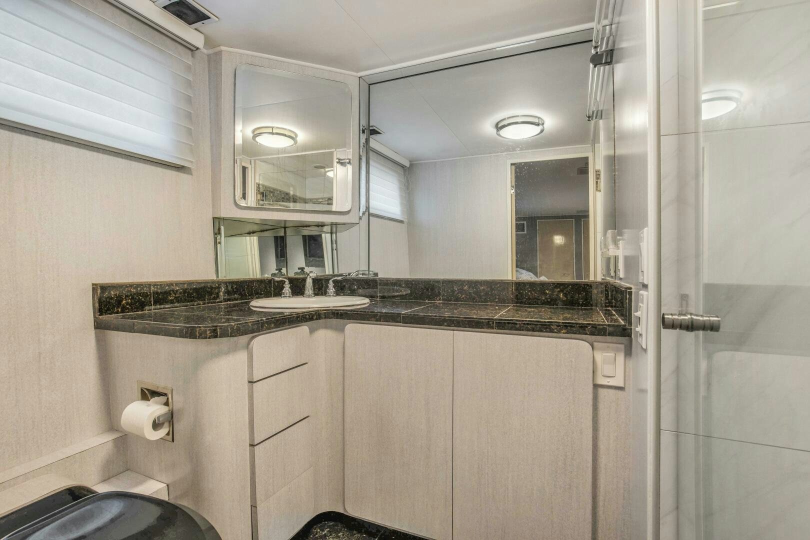a bathroom with a sink and a mirror aboard LADY P Yacht for Sale