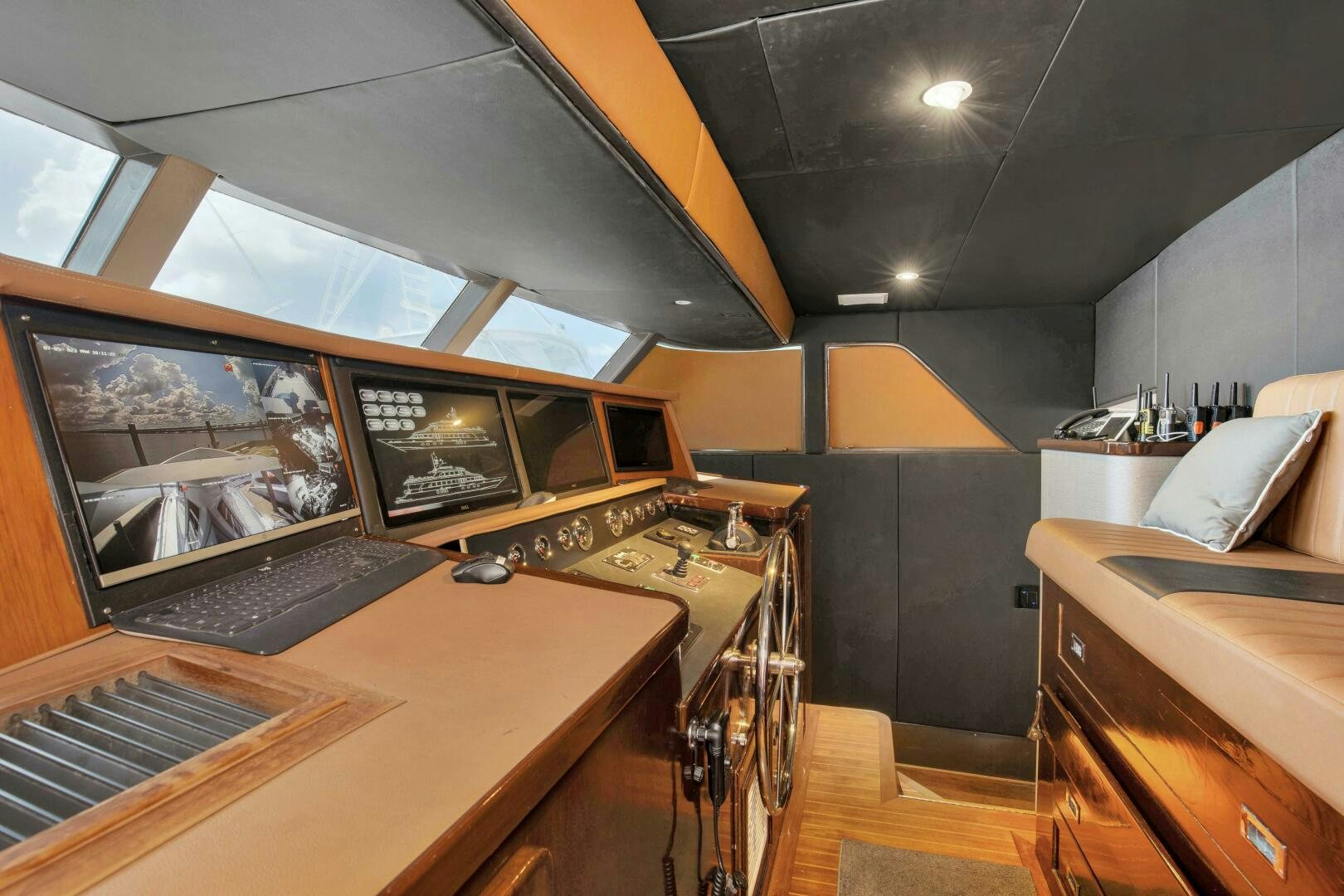 a kitchen with a large tv aboard LADY P Yacht for Sale