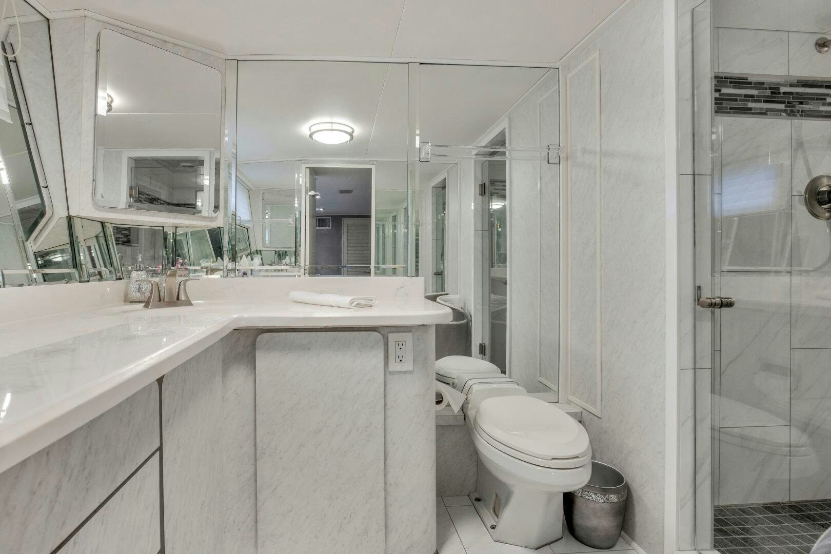 a bathroom with a sink toilet and a shower aboard LADY P Yacht for Sale