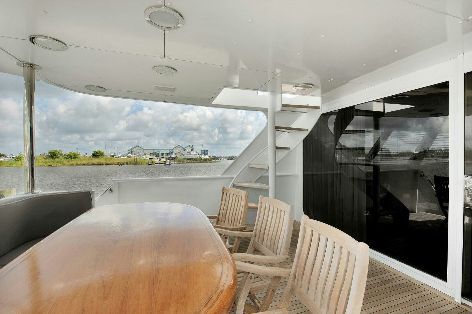 a room with a table and chairs aboard LADY P Yacht for Sale
