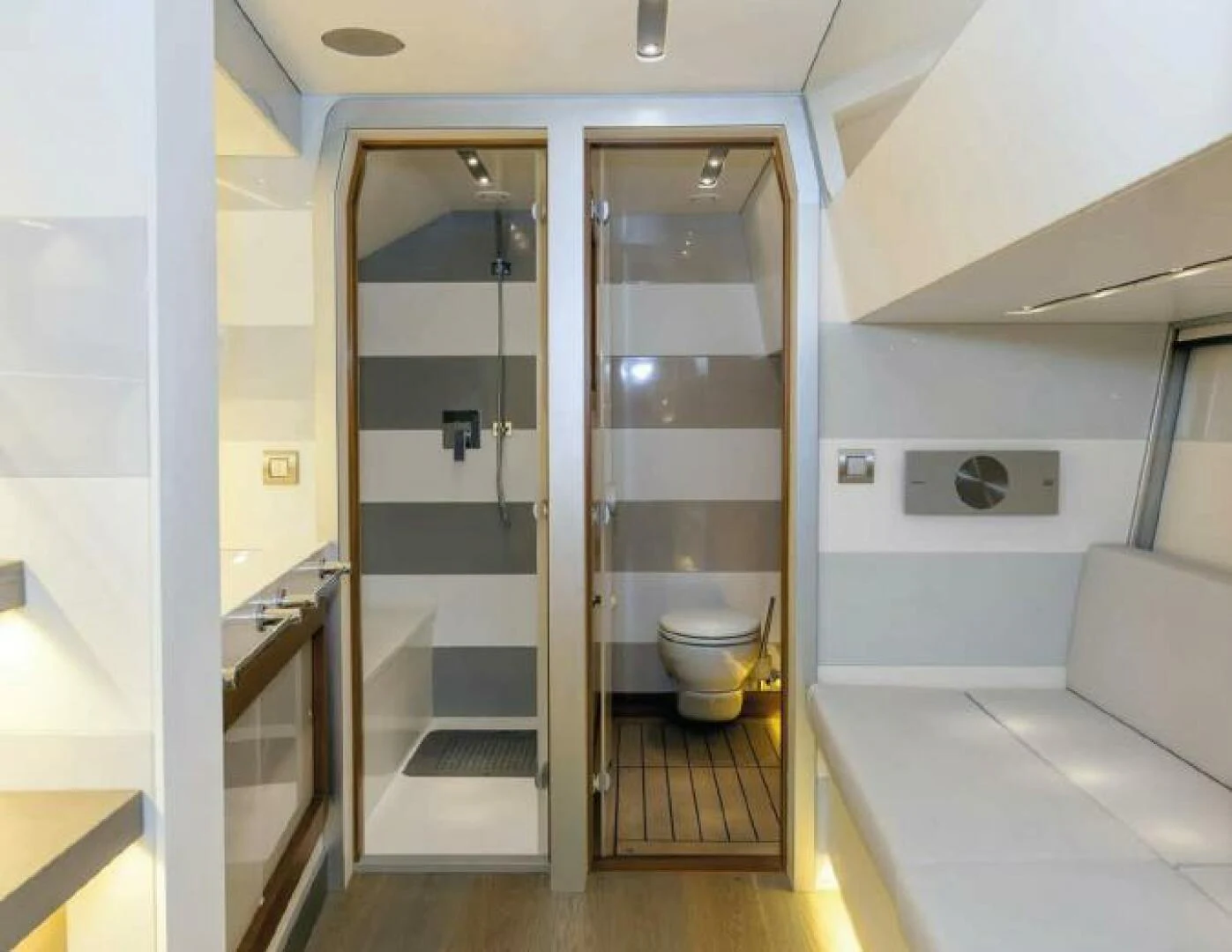 a bathroom with a glass shower aboard NAVCAT Yacht for Sale