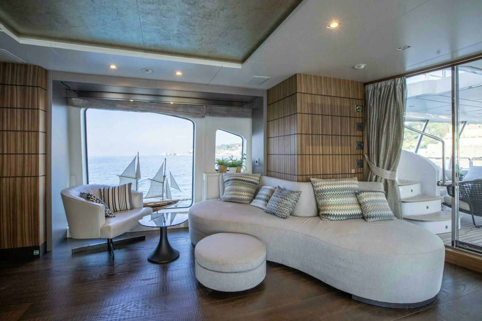 a large living room with a large window aboard SAFAD Yacht for Sale